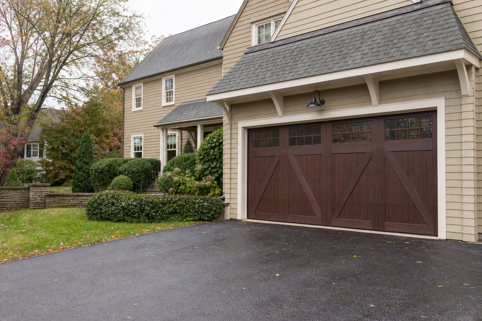 Suburban Lexington home with a visible garage door on a cloudy New England day