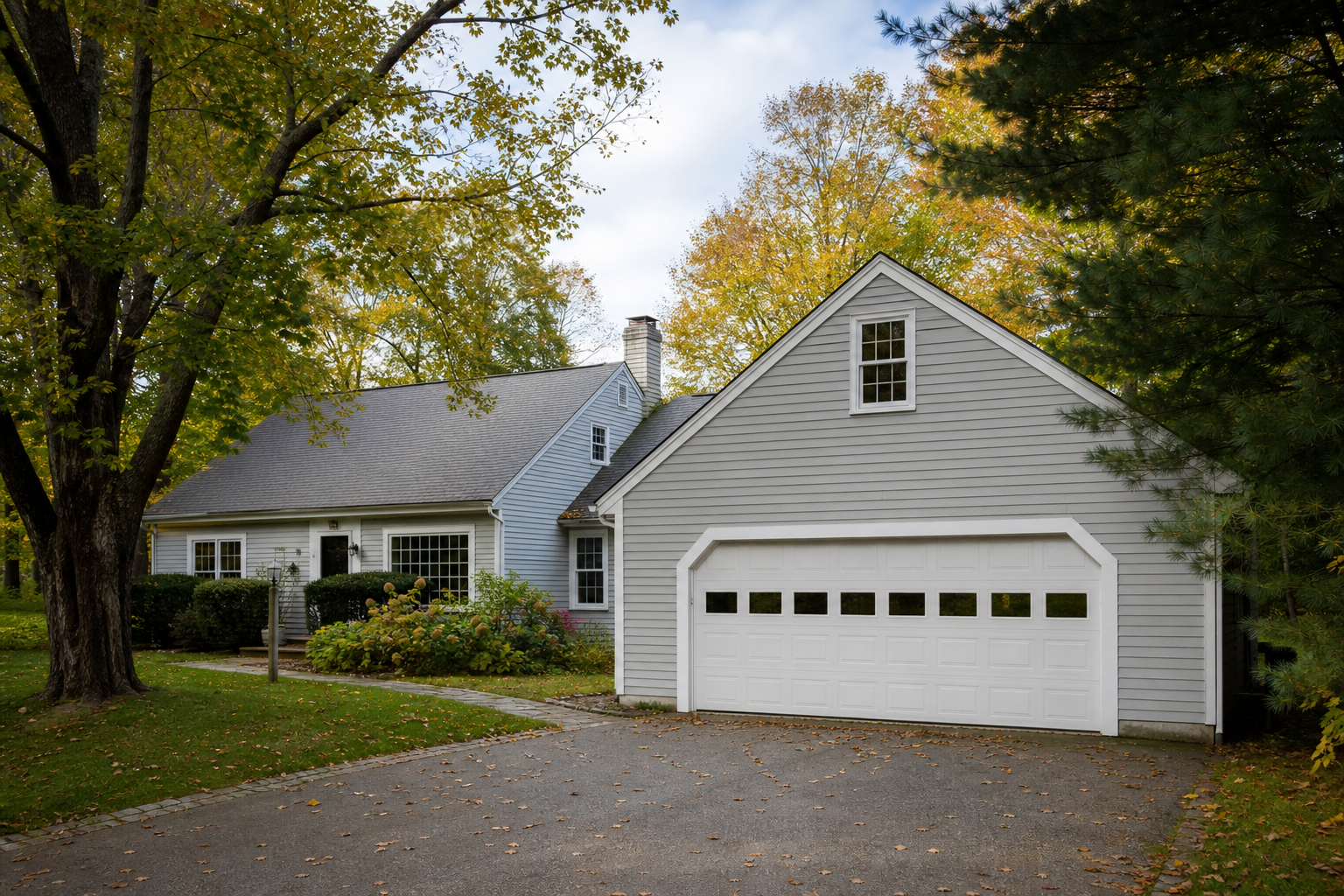 Lexington MA home exterior with a visible garage door and driveway
